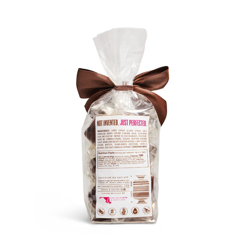 A clear bag of MOUTH PARTY - CHOCOLATE SEA SALT caramels from MOUTH PARTY, tied with a shiny brown ribbon. The label features a pink lips logo and product details.