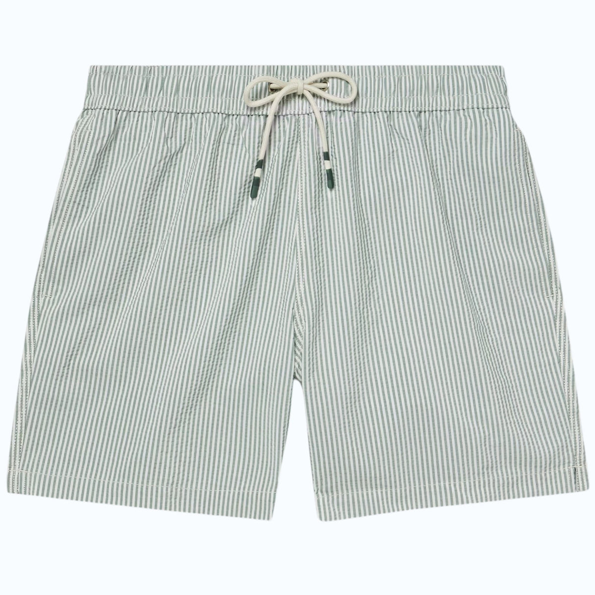 A person wearing HARTFORD - SEERSUCKER SWIM TRUNKS IN GREEN with an elastic waistband and drawstring stands against a plain light background.