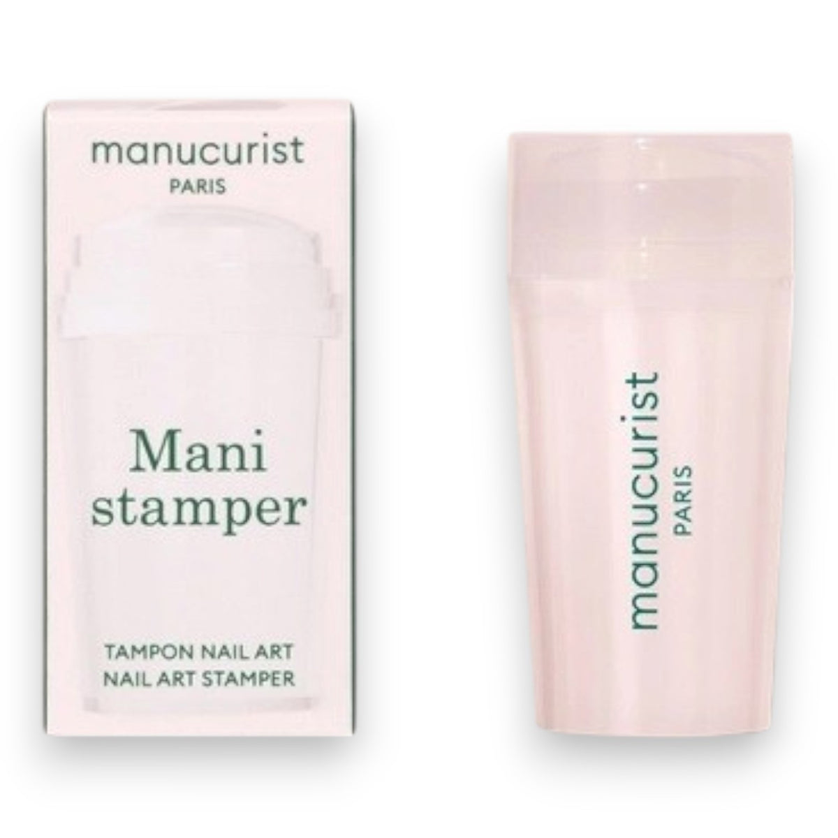 A hand with a light pink French manicure rests beside the MANUCURIST - MANI STAMPER by MANUCURIST INC on a pale background.