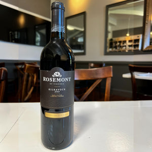 A bottle of ROSEMONT ‘KILVAROCK’ MERLOT BLEND 2022 from WINE: OCEAN SOUTH IMPORTS, featuring a black label with gold accents, photographed against a white background—an elegant Virginia red wine crafted as a refined Merlot blend.