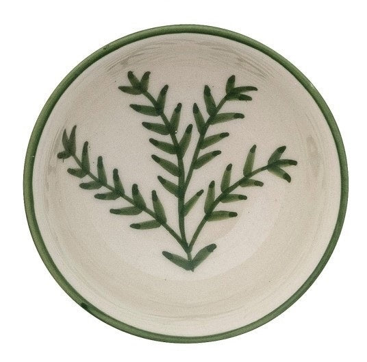 CREATIVE COOP's HAND-PAINTED STONEWARE BOWLS WITH BOTANICAL DESIGN, some holding green peppers or grains, are arranged on a light beige surface—each bowl highlights its unique handcrafted artistry.