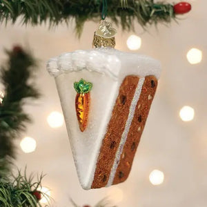 Old World Christmas CARROT CAKE ORNAMENT shaped like a slice of carrot cake with white cream cheese icing and a small carrot decoration.