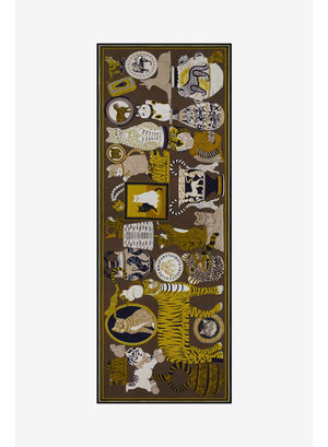 The INOUI EDITIONS - COLLECTIONNEUR Wool Scarf with Cats in Khaki by INOUI is a rectangular accessory crafted in India from 100% wool. It features an artistic collage-like pattern of illustrated cats and circular motifs in shades of gold, white, black, and gray set against a dark khaki background. Measuring 70 x 190 cm, this striking scarf adds both warmth and a touch of artistry to any ensemble.