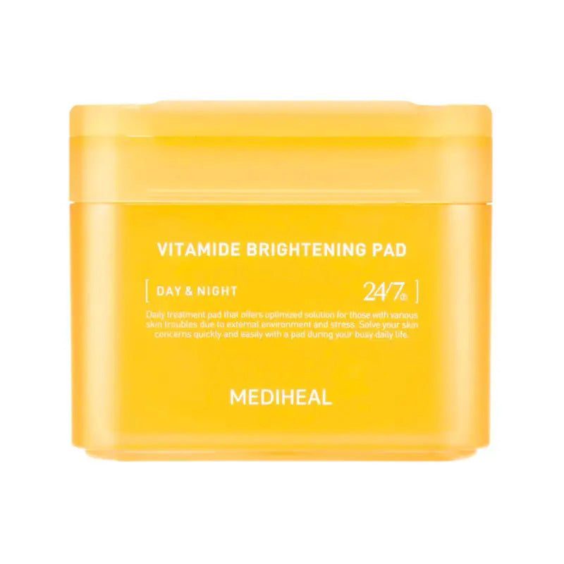 A yellow container labeled &quot;VITAMIDE BRIGHTENING PAD 100PC&quot; by EXOD INTERNATIONAL, infused with Sea Buckthorn for a luminous glow. The text includes &quot;Day &amp; Night&quot; and &quot;24/7.&quot; Minimalistic packaging with sleek white text promises that coveted glass skin.