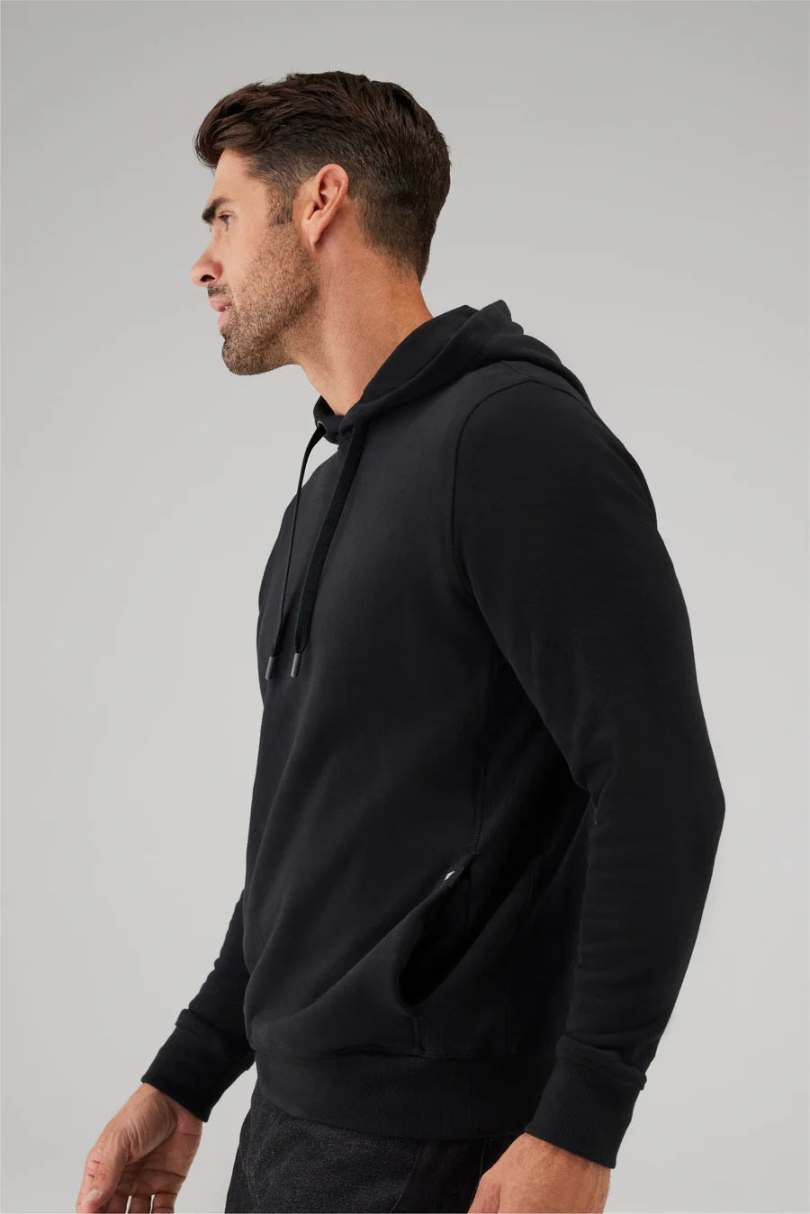 The MACK WELDON Ace Pullover Hooded Sweatshirt in Burnt Sage is a light green French terry hoodie with long sleeves, a front pocket, adjustable drawstrings, and a streamlined fit, shown laid flat on a white background.