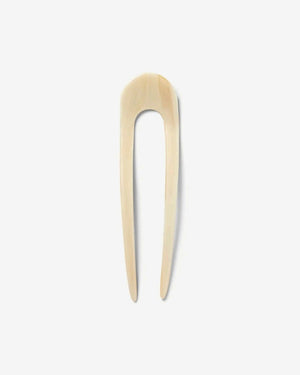 A smooth, black MACHETE - FRENCH HAIR PIN with two prongs, crafted from Italian acetate by MACHETE, rests on a plain white surface.