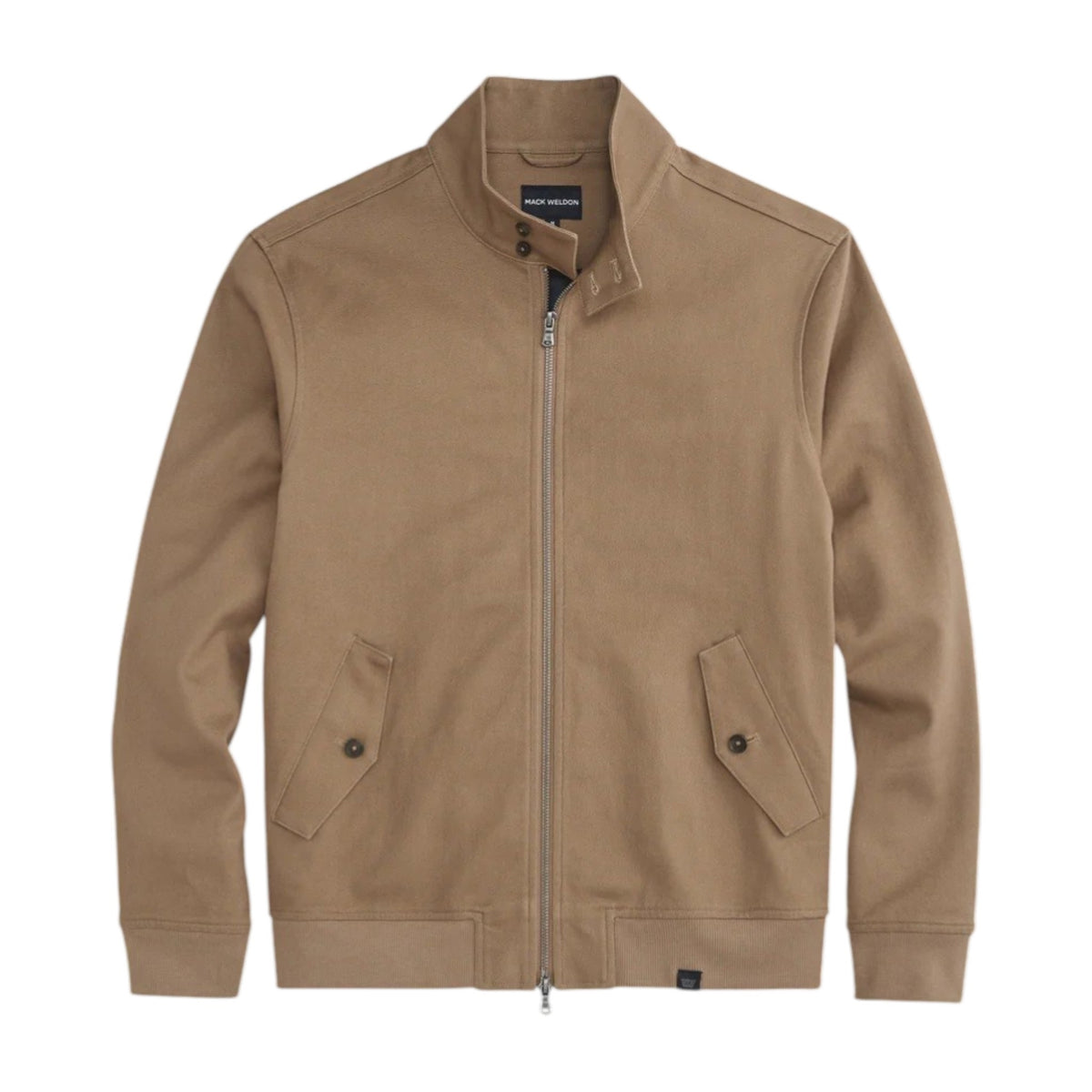 Close-up of a person wearing the MACK WELDON Twill Harrington Jacket in Shroom, featuring a zip front and buttoned flap pocket. Their arm is relaxed by their side and dark denim jeans are partially visible.