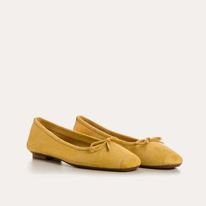 REQINS - HARMONY SUEDE BALLERINA FLATS IN OCHRE: a pair of ochre suede ballet flats with a small bow detail at the toes.
