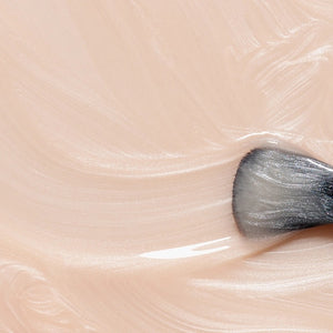 A bottle of MANUCURIST INC’s GREEN™ Nail Polish in Pearlescent, featuring a quick-dry formula and intense color payoff. This vegan, non-toxic nail polish has a black cap and contains a shimmery off-white shade, delivering brilliant results without compromising on safety or performance.