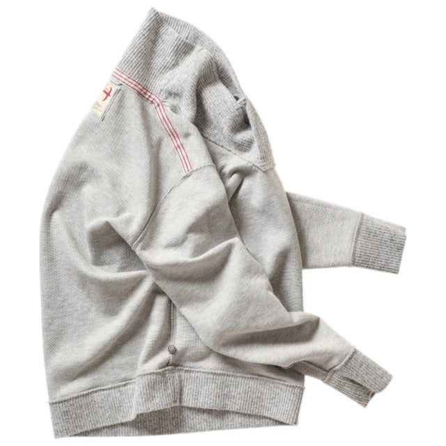 The RELWEN Ridge Twist Shawl Sweater in Pale Grey Heather is a vintage-style piece with ribbed cuffs and hem, a hood, and a small tag near the neckline, shown laid flat on a white background.