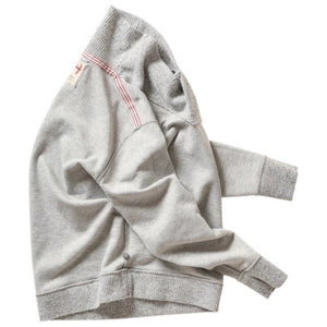 The RELWEN Ridge Twist Shawl Sweater in Pale Grey Heather is a vintage-style piece with ribbed cuffs and hem, a hood, and a small tag near the neckline, shown laid flat on a white background.