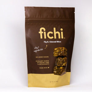 A brown and beige package labeled "FICHI - FIG AND ALMOND BITES" features three stacked bites. This vegan, gluten-free snack from FICHI contains only two ingredients, no added sugars, plus fiber and antioxidants.