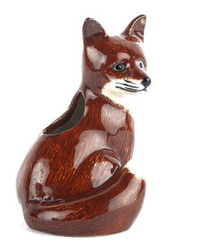 The QUAIL CERAMICS - FOX BUD VASE by QUAIL DESIGNS is a hand-painted stoneware planter with a glossy brown and white finish, featuring alert ears, detailed facial features, and a hollowed back for displaying your favorite plants.