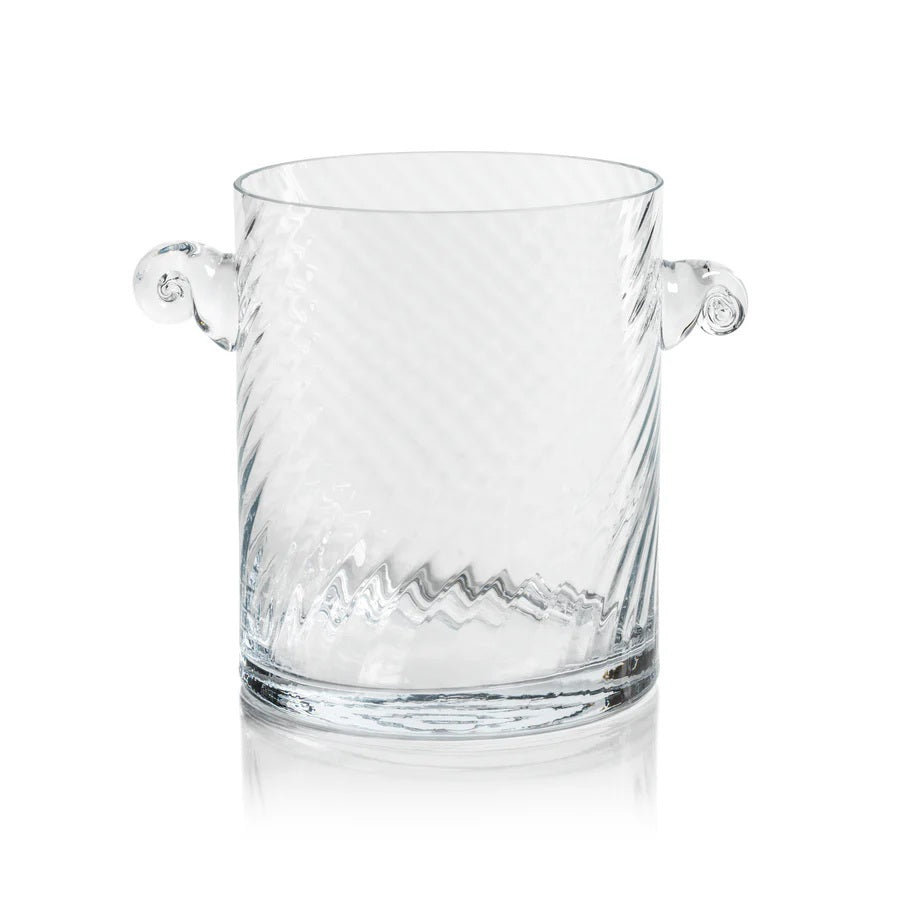The BAGATELLE SWIRL GLASS ICE BUCKET by ZODAX features a clear, textured spiral design with diagonal swirls and two round handles—a modern bar accessory shown on a white background.