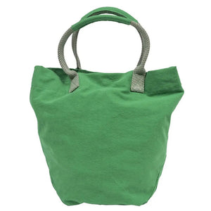 The TRAVAUX EN COURS CANVAS TOTE BAG is a versatile teal accessory with beige 100% cotton canvas handles. It features a spacious main compartment, with securely stitched handles ideal for carrying by hand or over the shoulder.