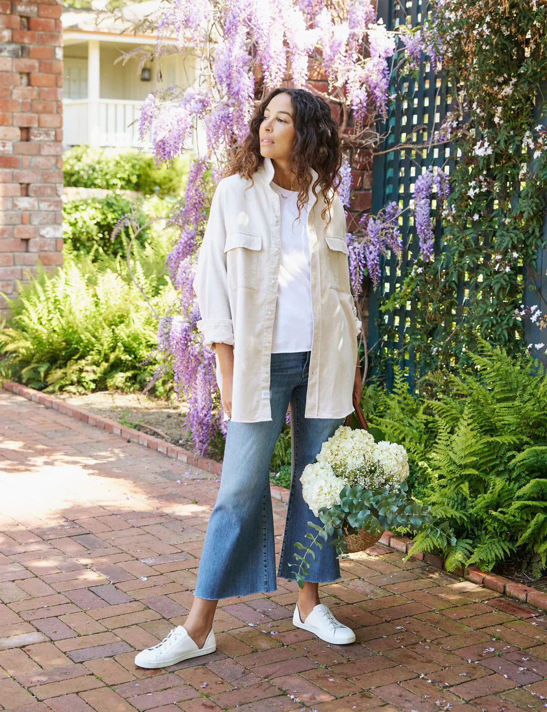 The FRANK &amp; EILEEN Galway Gaucho Jean in the 1972 Wash offers a high-waisted, wide-leg design with a subtle faded effect and classic five-pocket styling, perfectly embodying the spirit of Italian Dream Denim. Featuring a raw hem for that iconic gaucho-style, these light blue jeans are showcased against a lightly textured background.