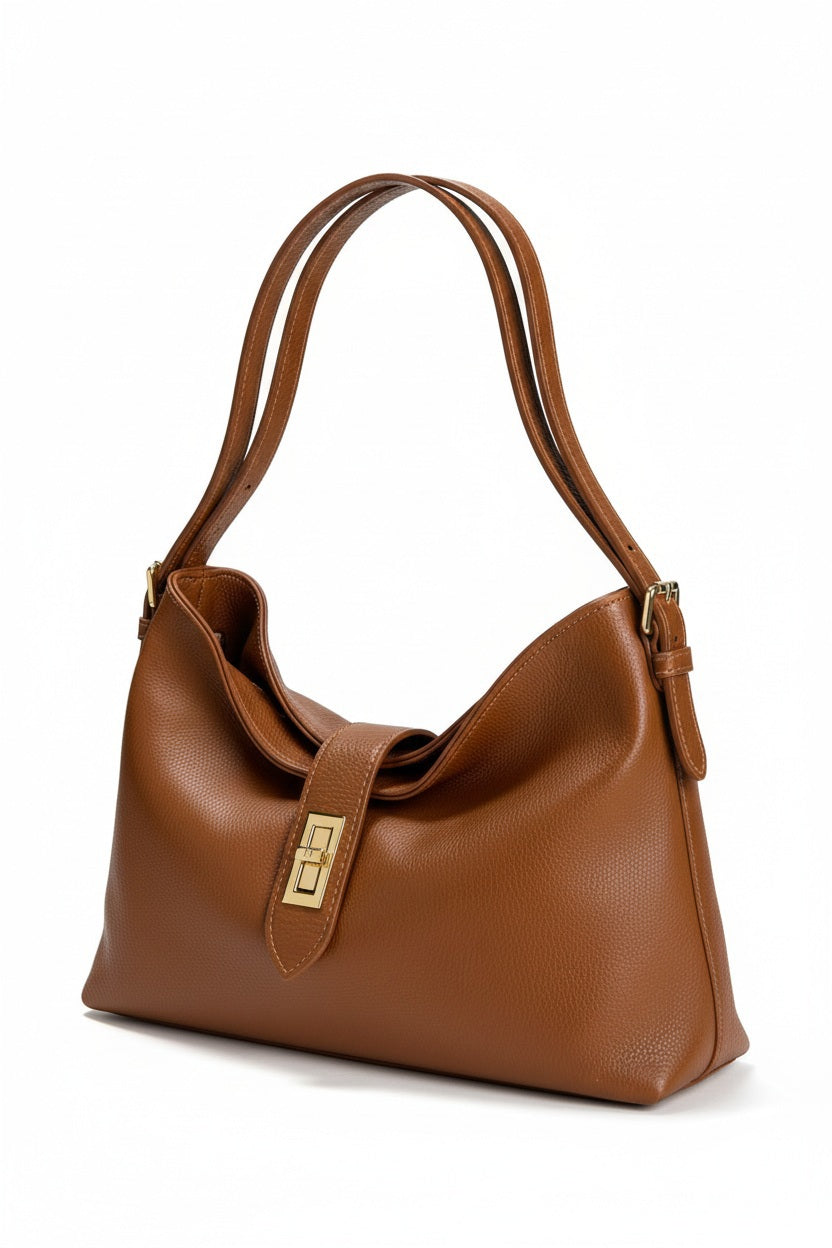 LEATHER HANDBAG IN COGNAC, a cognac-colored pebbled leather hobo bag featuring a gold-tone turn-lock clasp and shoulder straps.