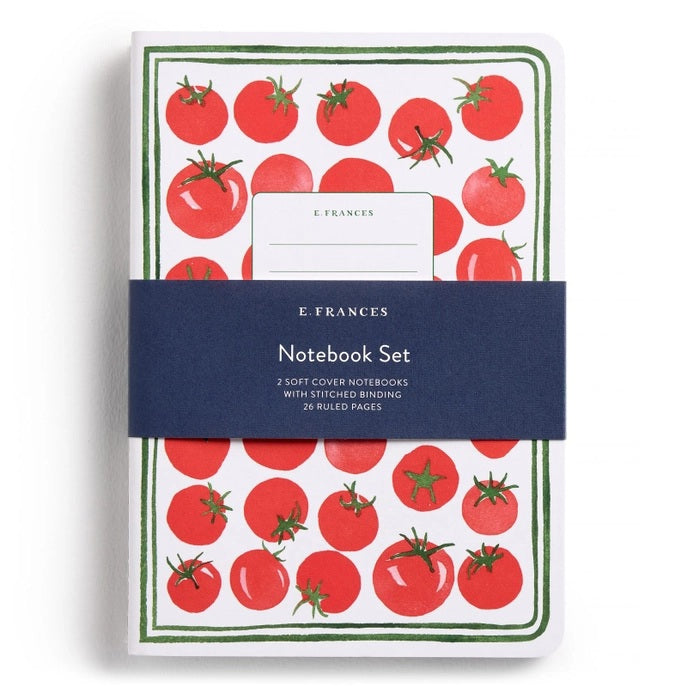 The E. FRANCES PAPER STITCHED NOTEBOOKS GARDENER, SET OF 2, featuring a green and white checkered cover, is open on a white surface next to two striped pencils—one green and one pink—with the right page blank.