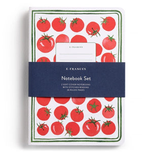 The E. FRANCES PAPER STITCHED NOTEBOOKS GARDENER, SET OF 2, featuring a green and white checkered cover, is open on a white surface next to two striped pencils—one green and one pink—with the right page blank.