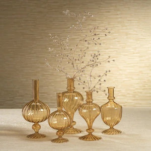 The ZODAX Venetian Spiral Vase in Amber Onion Shape, 7.5”, features a vintage-inspired, translucent amber design with a spherical body, narrow neck, and fluted round base, crafted in the style of borosilicate glass and presented on a white background.