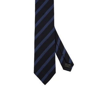 The AMANDA CHRISTENSEN Striped Jacquard Woven Silk Tie in Blue, featuring a black base with diagonal dark blue stripes, is showcased against a white background.