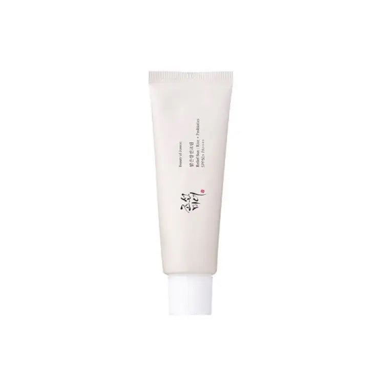 A white skincare tube with black text and red accents, featuring a secured cap, provides a minimalistic, elegant design. GLOWISS&#39;s BEAUTY OF JOSEON - RELIEF SUN RICE SPF50 offers lightweight sun protection. The background is plain white.