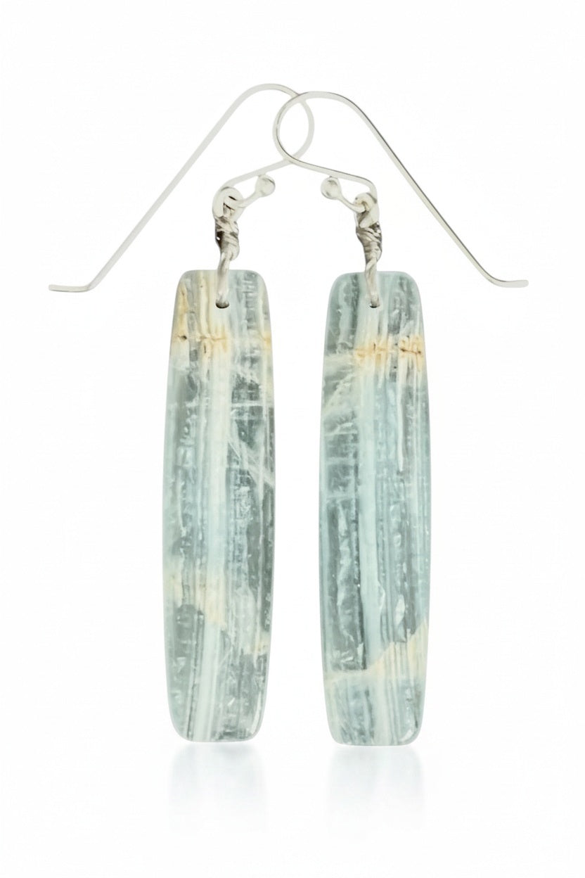 The ANN LIGHTFOOT - BLUE CALCITE SLAB EARRINGS feature long, rectangular, translucent blue-green calcite stones with natural streaks, suspended from sterling silver earwires against a plain white background.