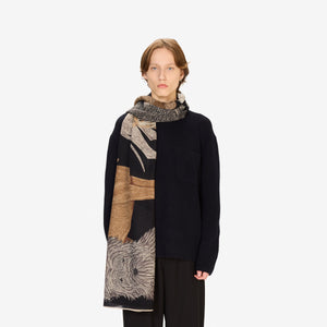 The INOUI EDITIONS - TOUTOU DOGGIE WOOL SCARF by INOUI features illustrated dogs of various breeds, sizes, and colors playfully arranged on a dark background. Made in India.