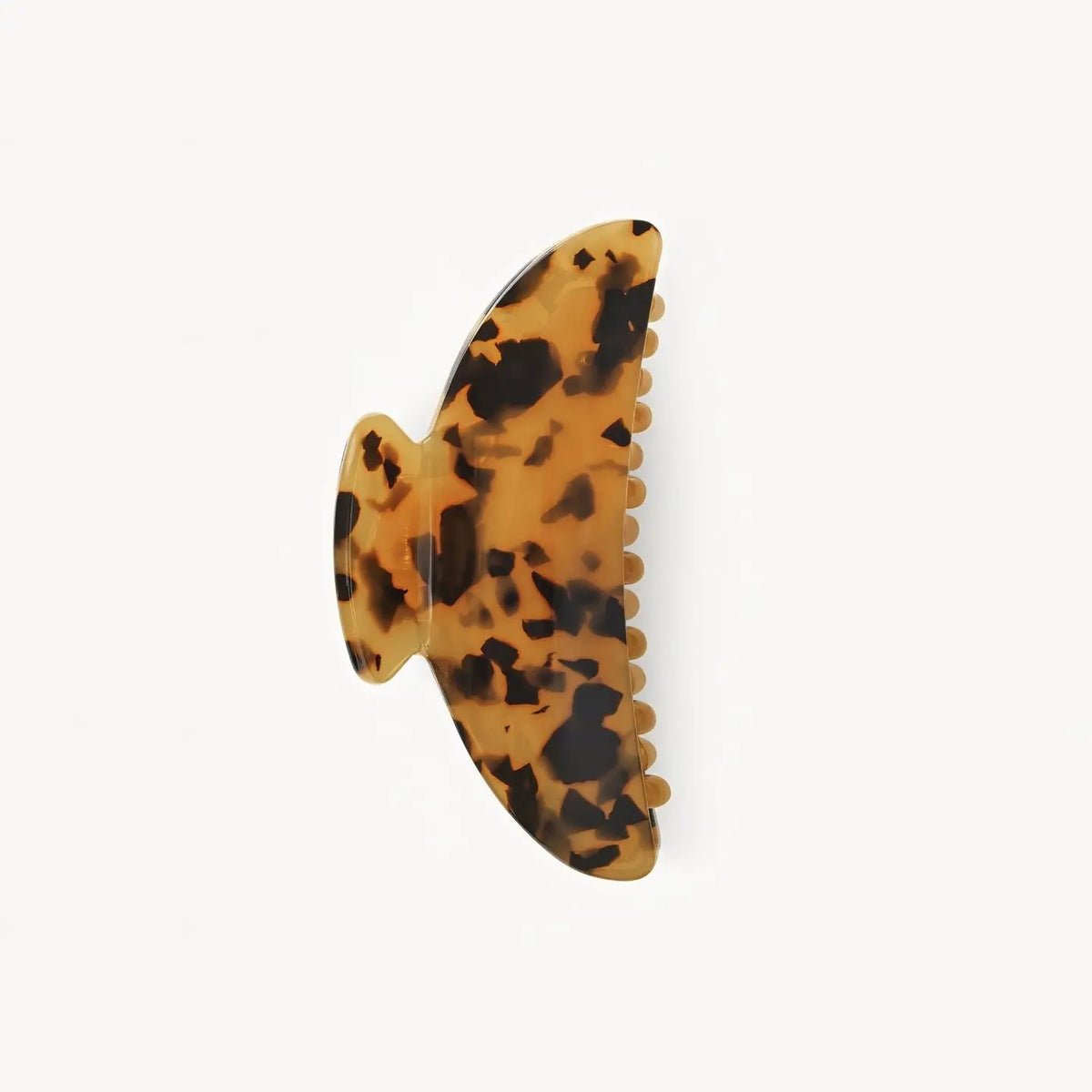 The MACHETE - MIDI HEIRLOOM CLAW IN TORTOISE is a midi hair clip crafted from Italian acetate with a tortoiseshell pattern and interlocking teeth, displayed against a plain white background.