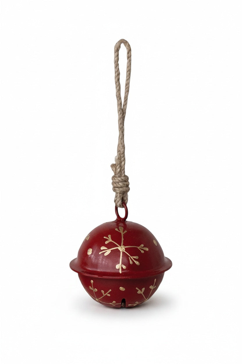 Creative Co-op JINGLE BELL ORNAMENT WITH SNOWFLAKES, a red jingle bell with gold painted snowflake designs hanging from a looped jute rope.
