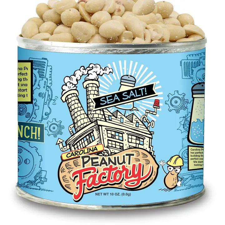 A tin of 1949 Nut Company Sea Salt peanuts is shown. The packaging is blue with artistic illustrations of a factory, gears, peanuts, and a salt shaker. The label reads &quot;1949 Nut Company&quot; with &quot;Sea Salt!&quot; in bold text. Enjoy these delicious peanuts! Net weight is 10 oz.