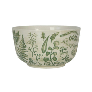 The HAND-STAMPED STONEWARE BOWL WITH BOTANICAL PATTERN by CREATIVE COOP features green leaf and fern illustrations encircling its white ceramic exterior, offering an artisan-inspired look.