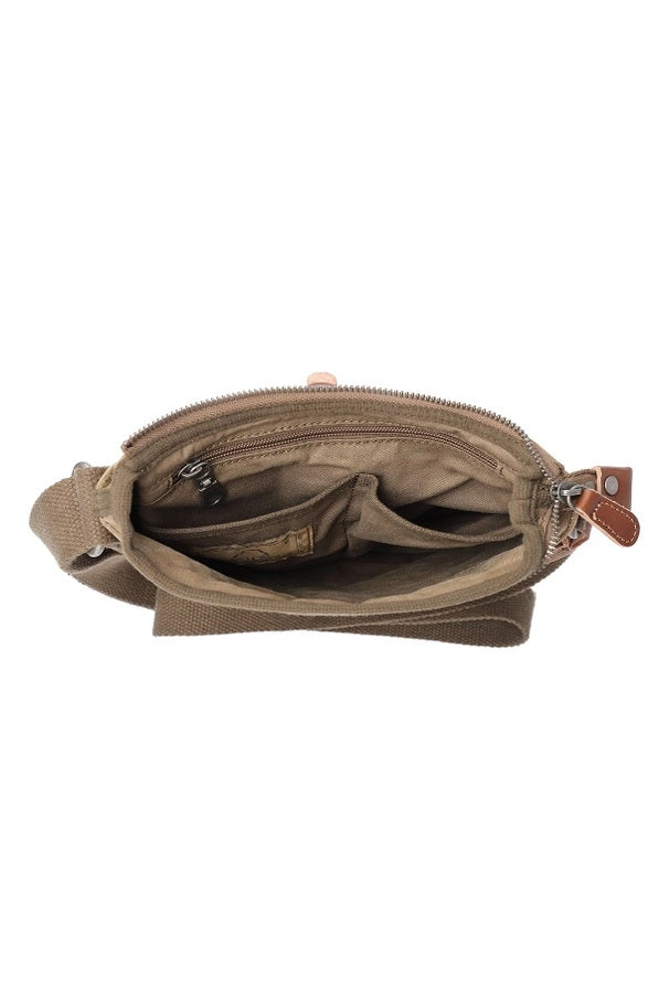 The TSD BRAND Forest Zip Crossbody Bag in olive features a khaki canvas design with a brown adjustable strap, front pocket, and brown leather strap with metal buckle and clasp—offering military-inspired style and practical utility.