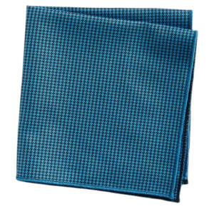 The CLIFTON WILSON Teal Houndstooth Cotton Pocket Square, made in the USA, is neatly folded and displayed on a white background.