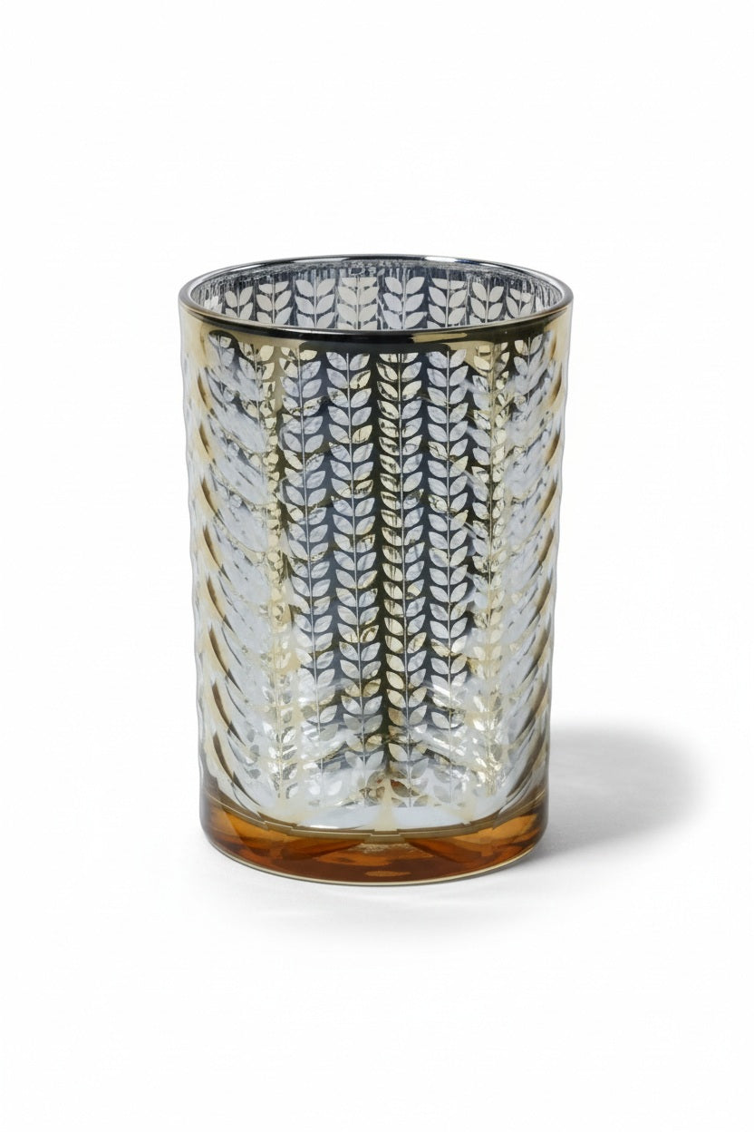 Three 4.5 in x 7 in cylindrical LARGE ETCHED METALLIC HURRICANE 7″ glass candle holders with a metallic gold leaf pattern, arranged on a matching gold serving tray.
