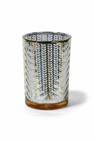 Three 4.5 in x 7 in cylindrical LARGE ETCHED METALLIC HURRICANE 7″ glass candle holders with a metallic gold leaf pattern, arranged on a matching gold serving tray.