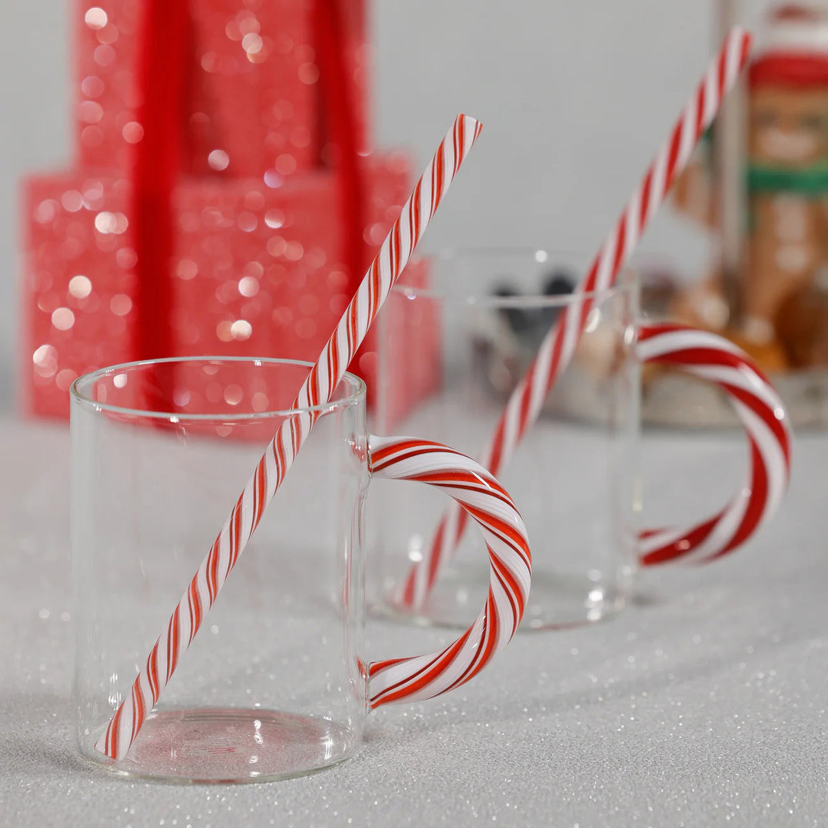 Five ZODAX HOLIDAY GLAS MUGs (430 ml each) with unique candy cane–shaped handles in assorted red, white, or green stripes are lined up on a white background.