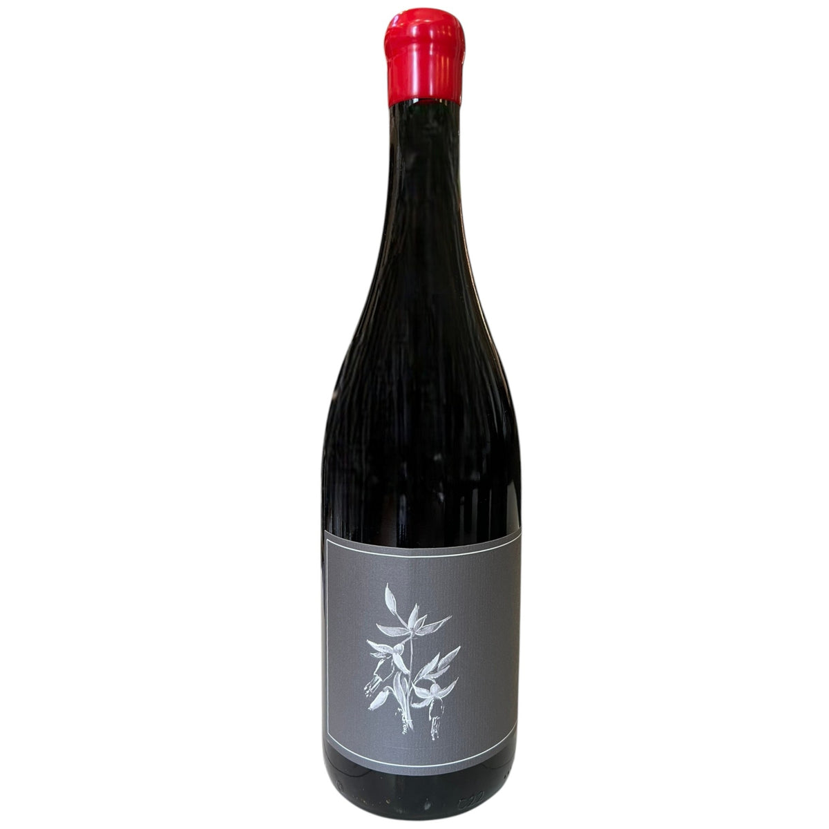 A bottle of ARNOT ROBERTS TROUSSEAU 2024 red wine featuring a red wax seal and a grey label with a white botanical illustration.