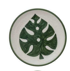 Set of four CREATIVE COOP HAND-PAINTED STONEWARE PLATES, each with a unique botanical design and green rim. Delicate green leaf patterns make every appetizer plate an artful addition to your table.