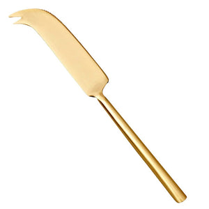 The BE HOME - MATTE GOLD CHEESE KNIFE by BE HOME, INC features a curved blade and two-pronged tip, ideal for charcuterie boards. Shown isolated on a white background.