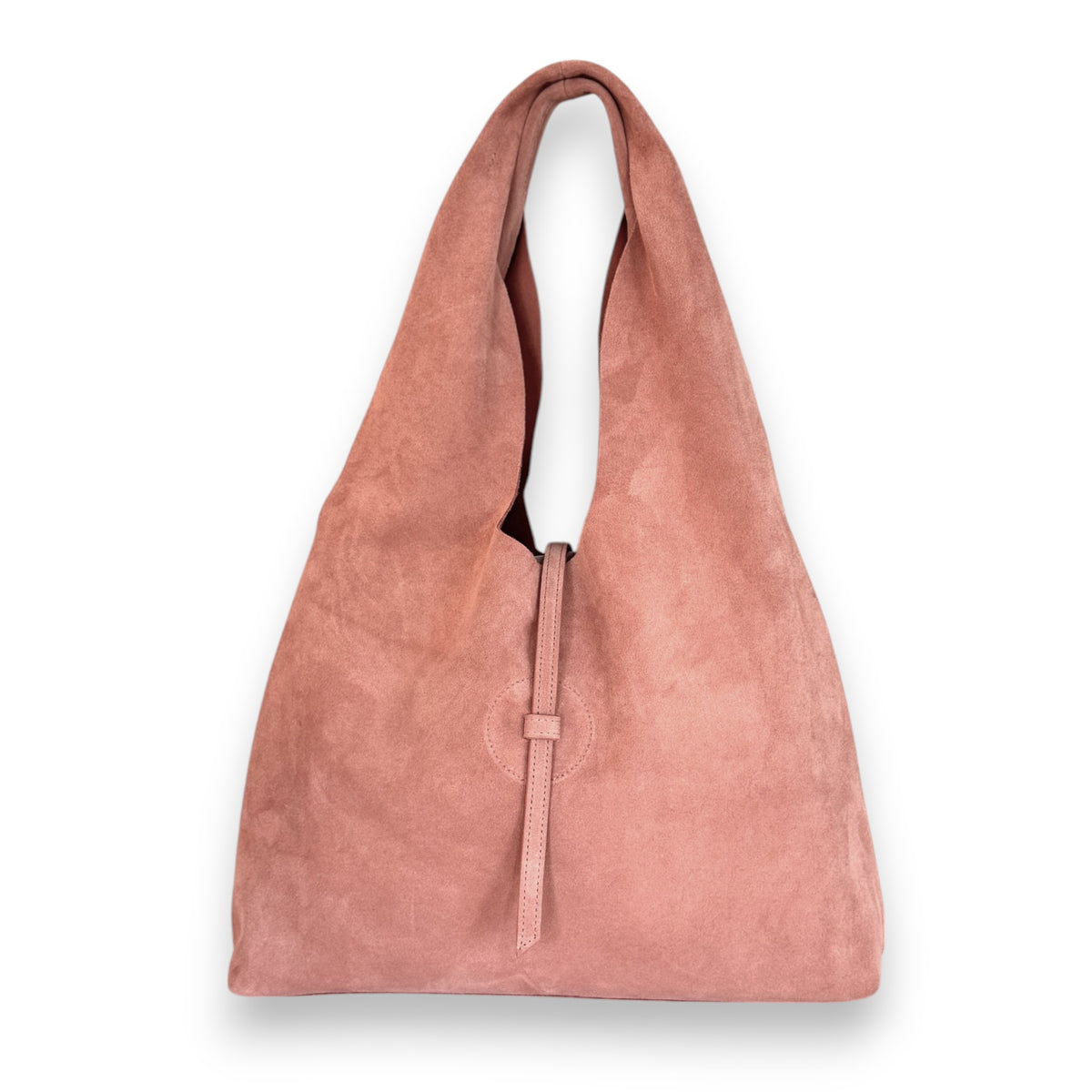 The OLIVEVE Elisabetta Shopper in blush Italian leather-backed suede is displayed. It boasts a slouchy design with a wide strap and narrow leather loop closure, set against a white background.
