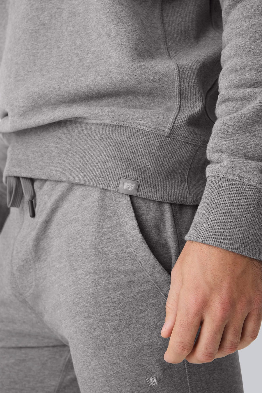 The MACK WELDON Ace Crew Neck Sweatshirt in True Navy Bird’s Eye features long sleeves, a streamlined fit, navy ribbed trim, soft French terry fabric, visible stitching details, and a small label at the bottom hem.