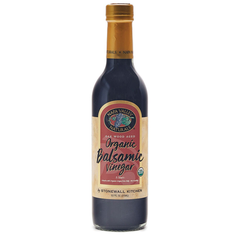 A 12.7 fl oz bottle of STONEWALL KITCHEN Organic Balsamic Vinegar is pictured. The bottle contains a dark-toned liquid and features a beige and dark red label. Made from Italian grapes, this 5-star vinegar is oak wood aged and certified organic by Stonewall Kitchen.