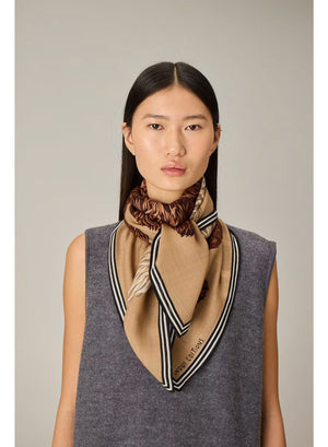 Illustration of a polar bear with white fur standing above and slightly overlapping a brown grizzly bear, both facing to the right, set against a plain beige background inspired by the INOUI EDITIONS OURS WOOL SCARF made from 100% wool in India.