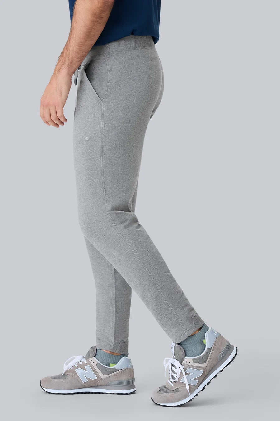 MACK WELDON Ace Sweatpants in Burnt Sage feature an elastic waistband, adjustable drawstring, zippered side pocket, and tapered legs for a tailored fit; shown flat on a plain background.