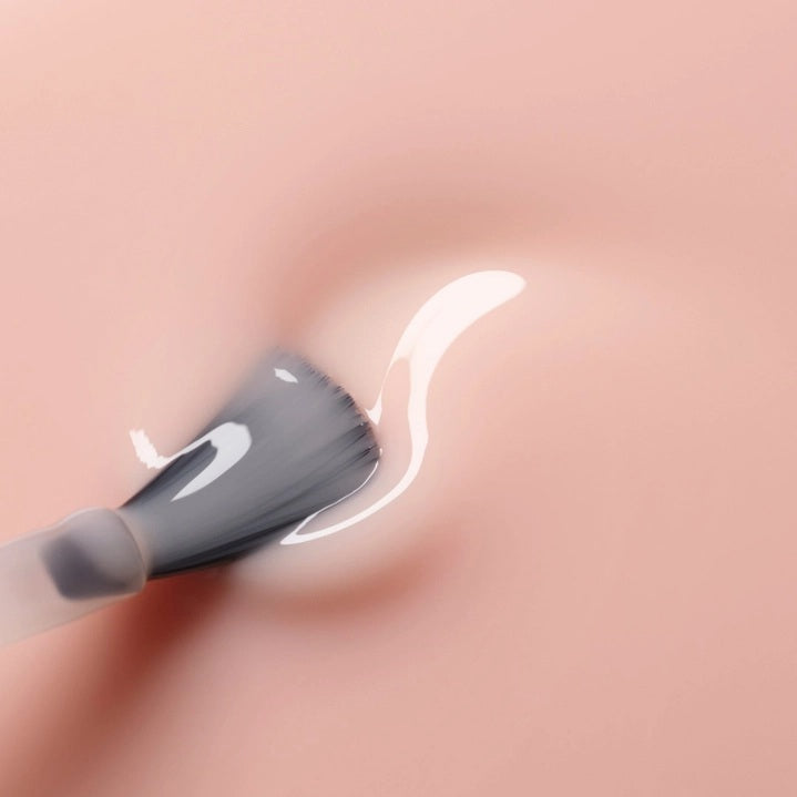 Five glossy-finished, non-toxic MANUCURIST nail polish swatches—including the GREEN™ NAIL POLISH IN PALE ROSE—labeled Milky White, Milky Pink, Hortencia, Pale Rose, and Beige, display a gradient of shades ranging from white through pale pink to nude tones.