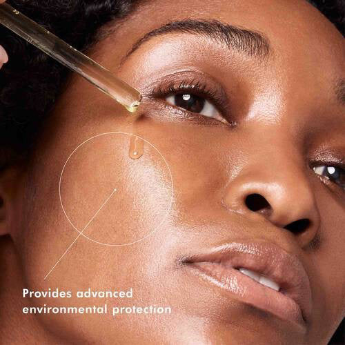 Image showing instructions for applying the SKINCEUTICALS - CE FERULIC serum in two steps:

Step 1: &quot;In the morning after cleansing, dispense 4-5 drops of SKINCEUTICALS - CE FERULIC into clean hands.&quot; (Photo of a person dropping serum onto their hand.)
Step 2: &quot;Gently press SKINCEUTICALS - CE FERULIC into the skin on your face, neck, and décolletage. Follow with any other skincare products and sunscreen for environmental protection.