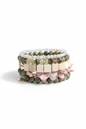 The DAVID AUBREY ATHENA Agate, Jasper, Pearls, and Glass Wrap Bracelet features handcrafted green, white, gold, and pink beads of varying shapes—some with gray agate—coiled together and displayed on a gray background.