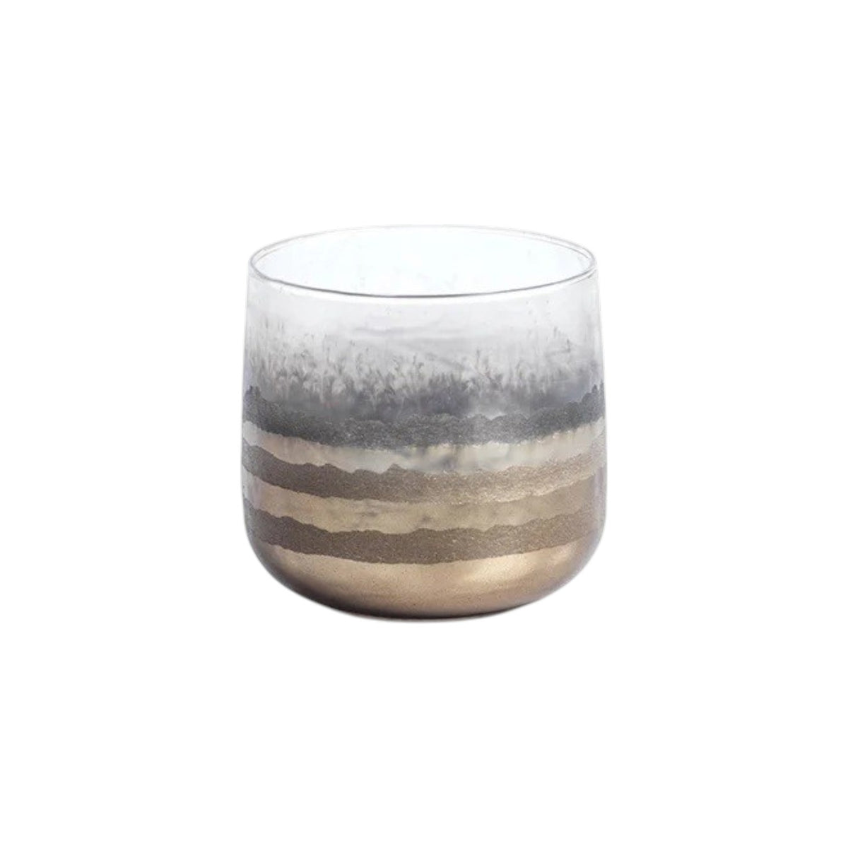 Three ZODAX GOLD SMOKE VOTIVE HOLDERS, featuring a hand-applied finish of metallic and frosted horizontal stripes, each with a lit candle inside, are arranged on a white surface against a yellow background, casting a warm metallic glow.
