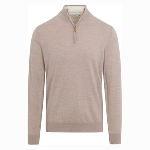 A man in glasses, wearing the COLLARS AND CO Cashmere Touch Australian Merino Wool 1/4 Zip Sweater in Oatmeal and dark jeans, walks on a cobblestone street holding a phone and a brown folder, with buildings and plants in the background.